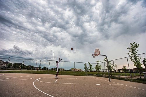 MIKAELA MACKENZIE / WINNIPEG FREE PRESS

Brendan Amoyaw, 16, practices on the court as a storm rolls in at Ron Duhamel Park in Sage Creek in Winnipeg on Friday, July 17, 2020. Standup.
Winnipeg Free Press 2020.