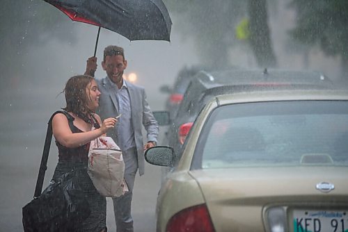 JESSE BOILY  / WINNIPEG FREE PRESS
Newly wed Mark holds the umbrella for their wedding photographer on Friday. Friday, July 17, 2020.
Reporter: