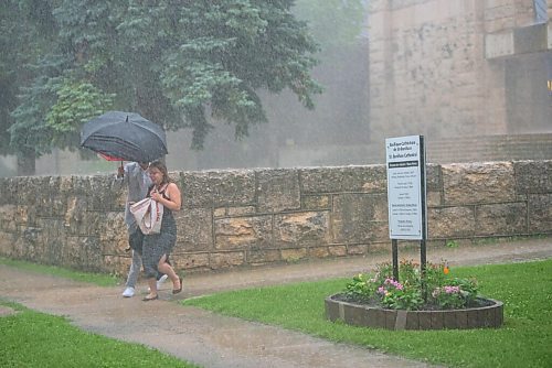 JESSE BOILY  / WINNIPEG FREE PRESS
Newly wed Mark holds the umbrella for their wedding photographer on Friday. Friday, July 17, 2020.
Reporter: