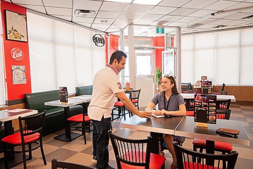 Mike Sudoma / Winnipeg Free Press
Sams owner/manager, Gabriel Rosenfeld, serves up a coffee to reporter Nadya Pankiw inside his restaurant Friday afternoon
July 17, 2020