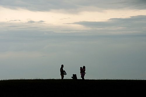 Mike Sudoma / Winnipeg Free Press
The Dhingra family enjoys a moment while watching storm clouds atop Garbage Hill Friday afternoon
July 17, 2020