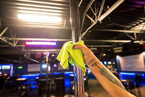 Mike Sudoma / Winnipeg Free Press
Lipstixx Eperience employee, Tracy Pottinger sanitizes a dancer pole as sanitization practises take place more frequently since the club has re-opened after the CoVid 19 quarantine.
July 18, 2020