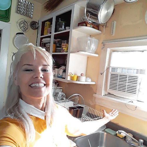 Canstar Community News
Et voilà correspondent Shirley Kowalchuk shows off her new kitchen window frame, newly repaired just in time for last months heat wave to wane.