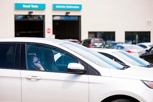 MIKAELA MACKENZIE / WINNIPEG FREE PRESS

Charissa McKenzie waits in line-up to get her daughter tested at the drive-through COVID-19 testing site on Main Street in Winnipeg on Tuesday, July 21, 2020. For Malak Abas story.
Winnipeg Free Press 2020.