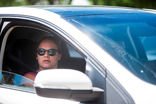 MIKAELA MACKENZIE / WINNIPEG FREE PRESS

Charissa McKenzie speaks to the Free Press while waiting in line-up to get her daughter tested at the drive-through COVID-19 testing site on Main Street in Winnipeg on Tuesday, July 21, 2020. For Malak Abas story.
Winnipeg Free Press 2020.