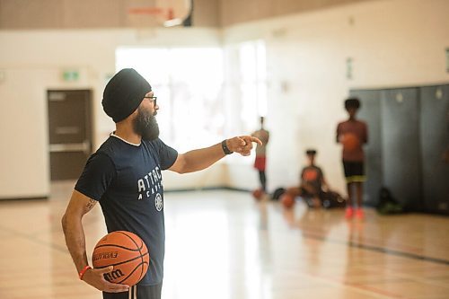Mike Sudoma / Winnipeg Free Press
Basketball player, Sukvhir Singh, talks to participants as he runs Attack Basketball Camp, alongside coach Mike Ragasa Tuesday afternoon at Amber Trails Community School.
July 21, 2020