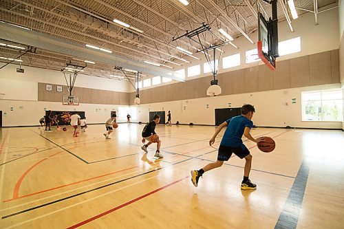 Mike Sudoma / Winnipeg Free Press
Attack Basketball Camp participants run a drill as they stay in their lanes, staying safely spaced apart from one another Tuesday afternoon
July 21, 2020