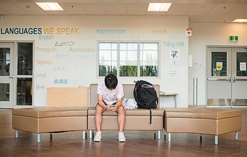 Mike Sudoma / Winnipeg Free Press
Attack Basketball Camp participant, Wayne Bu, waits in the front foyer of Amber Trails Community School as he waits for his camps time slot to start up Tuesday evening
July 21, 2020