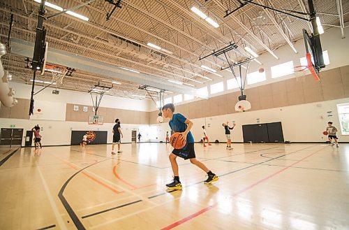 Mike Sudoma / Winnipeg Free Press
Attack Basketball Camp participants run a drill as they stay in their lanes, staying safely spaced apart from one another Tuesday afternoon
July 21, 2020