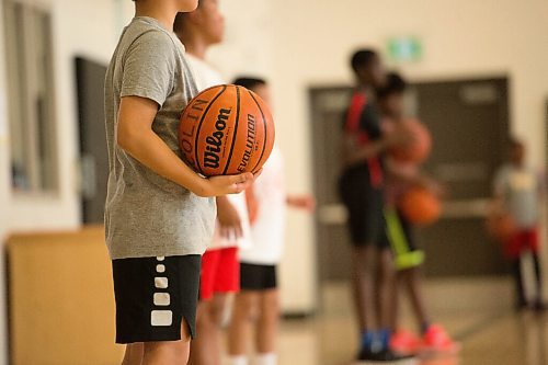 Mike Sudoma / Winnipeg Free Press
Attack Basketball Camp participants listen to their coach Sukvhir Singh as they stay safely spaced apart from one another Tuesday afternoon
July 21, 2020