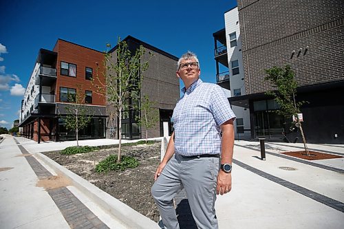 JOHN WOODS / WINNIPEG FREE PRESS
Christopher Storie, Director of the Institute of Urban Studies at the University of Winnipeg, is photographed beside a new mixed use development at Sage Creek Tuesday, July 21, 2020. Winnipeg continues to take up more space as urban sprawl continues as new urban developments continue to be built further from the downtown core.

Reporter: Sarah