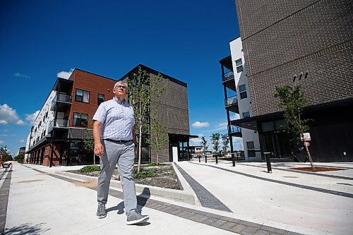 JOHN WOODS / WINNIPEG FREE PRESS
Christopher Storie, Director of the Institute of Urban Studies at the University of Winnipeg, is photographed beside a new mixed use development at Sage Creek Tuesday, July 21, 2020. Winnipeg continues to take up more space as urban sprawl continues as new urban developments continue to be built further from the downtown core.

Reporter: Sarah