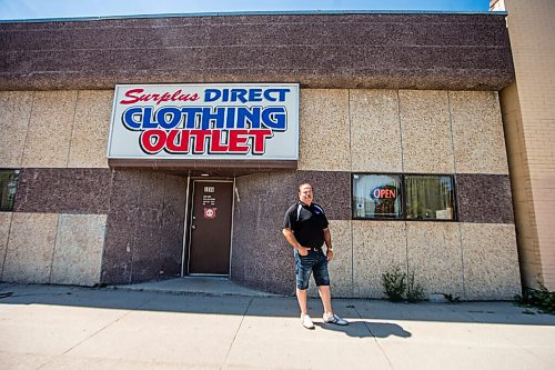 MIKAELA MACKENZIE / WINNIPEG FREE PRESS

Robert McDonald poses in front of his store, Surplus Direct Clothing Outlet, in Winnipeg on Wednesday, July 22, 2020. He is concerned about cars lined up in front of his business for the nearby drive through COVID-19 testing site. For Malak Abas story.
Winnipeg Free Press 2020.