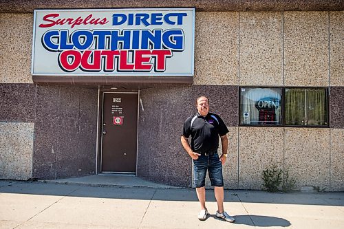 MIKAELA MACKENZIE / WINNIPEG FREE PRESS

Robert McDonald poses in front of his store, Surplus Direct Clothing Outlet, in Winnipeg on Wednesday, July 22, 2020. He is concerned about cars lined up in front of his business for the nearby drive through COVID-19 testing site. For Malak Abas story.
Winnipeg Free Press 2020.