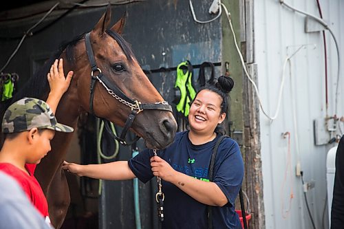 MIKAELA MACKENZIE / WINNIPEG FREE PRESS

Stakes winner Labhay with Jerry Gourneau barn team member Madison Tirk in Winnipeg on Friday, July 24, 2020. For George Williams story.
Winnipeg Free Press 2020.