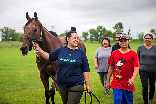MIKAELA MACKENZIE / WINNIPEG FREE PRESS

Madison Tirk leads stakes winner Labhay with Drake Peters  an other Jerry Gourneau barn team members at the Assiniboia Downs backstretch in Winnipeg on Friday, July 24, 2020. For George Williams story.
Winnipeg Free Press 2020.
