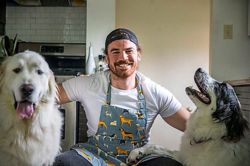 MIKAELA MACKENZIE / WINNIPEG FREE PRESS

Blue Bomber fullback John Rush, who just started a food blog called Rescue Dog Kitchen, poses for a portrait with his dogs, Bon Homme (left), and Bailey in Winnipeg on Friday, July 24, 2020. For Eva Wasney story.
Winnipeg Free Press 2020.