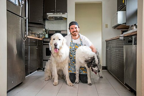 MIKAELA MACKENZIE / WINNIPEG FREE PRESS

Blue Bomber fullback John Rush, who just started a food blog called Rescue Dog Kitchen, poses for a portrait with his dogs, Bon Homme (left), and Bailey in Winnipeg on Friday, July 24, 2020. For Eva Wasney story.
Winnipeg Free Press 2020.