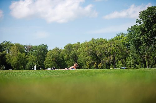 MIKAELA MACKENZIE / WINNIPEG FREE PRESS

Shauna Klimchuk catches some rays at Assiniboine Park in Winnipeg on Friday, July 24, 2020. A heat warning was in effect for temperatures reaching 32 degrees, with high humidity as well. Standup.
Winnipeg Free Press 2020.