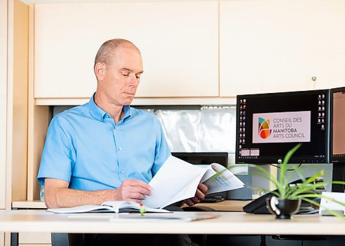 Mike Sudoma / Winnipeg Free Press
Randy Joynt, Executive Director of the Manitoba Arts Council, looks over Manitobas Cultural Action plan at his desk Friday afternoon
July 24, 2020