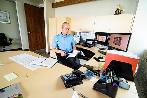 Mike Sudoma / Winnipeg Free Press
Randy Joynt, Executive Director of the Manitoba Arts Council, looks over Manitobas Cultural Action plan at his desk Friday afternoon
July 24, 2020