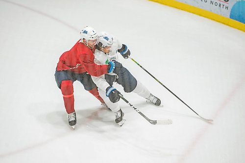 Mike Sudoma / Winnipeg Free Press
Winnipeg Jets defense, Neal Pionk (left) plays defence on Jets captain, Mark Scheifele during practice at the Iceplex Saturday morning
July 25, 2020