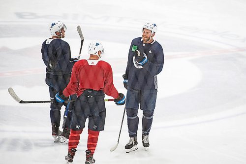 Mike Sudoma / Winnipeg Free Press
Winnipeg Jets Forward, Adam Lowry (right), talks with team mates Dmitry Kulikov (centre) and Andrew Copp (left) in between drills during practice Saturday morning
July 25, 2020