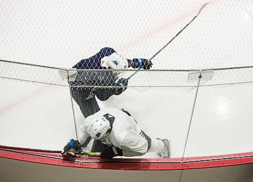 Mike Sudoma / Winnipeg Free Press
Winnipeg Jets captain, Mark Scheifele gets hit into the boards by Mathieu Perrault during practice at the Ice Plex Saturday morning
July 25, 2020