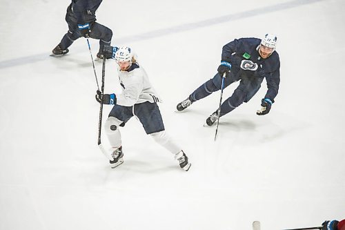Mike Sudoma / Winnipeg Free Press
Winnipeg Jets Forward, Kyle Connor, makes his way past Adam Lowry during practice at the MTS Iceplex Saturday morning
July 25, 2020