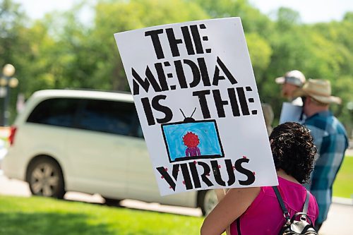 Mike Sudoma / Winnipeg Free Press
Members/Supporters of The Line, a group against the CoVid quarantine/restrictions, hold signs as they rally along Broadway St Saturday afternoon
July 24, 2020