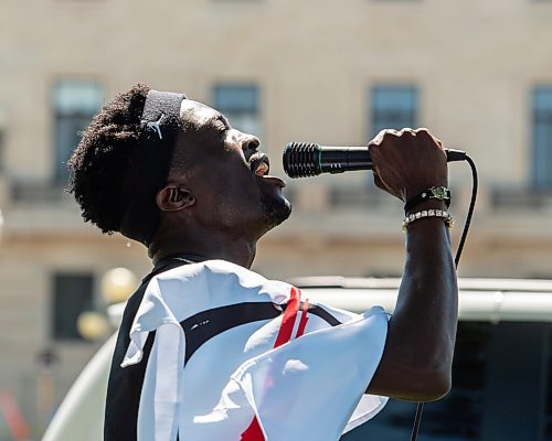 Mike Sudoma / Winnipeg Free Press
Theo Landry, a nurse at Childrens Hospital, performs a spoken word slam poem as he talks to Members/Supporters of The Line, a group against the CoVid quarantine/restrictions, as they rally along Broadway St Saturday afternoon
July 24, 2020