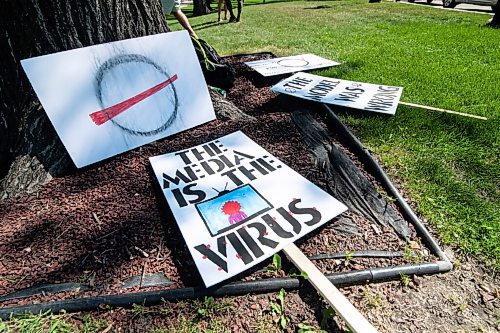 Mike Sudoma / Winnipeg Free Press
Picketing signs lay on the ground as Members/Supporters of The Line, a group against the CoVid quarantine/restrictions, rally along Broadway St Saturday afternoon
July 24, 2020