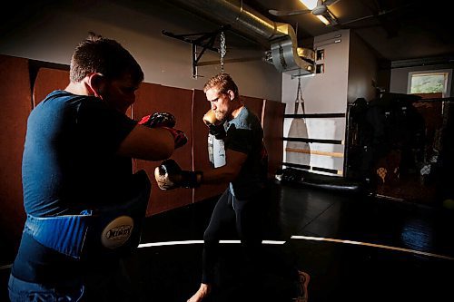 JOHN WOODS / WINNIPEG FREE PRESS
Mixed Martial Arts (MMA) fighter Mariusz Ksiazkiewicz works out with coach Lindsey Hawks in Winnipeg Sunday, July 26, 2020. Ksiazkiewicz has been signed to Dana Whites Contender Series. 

Reporter: Allen