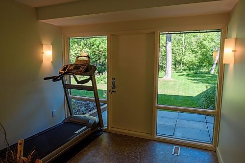 JESSE BOILY  / WINNIPEG FREE PRESS
Workout room looks out to the forested backyard at 565 Parkwood Place in University Heights. Monday, July 27, 2020.
Reporter: Todd