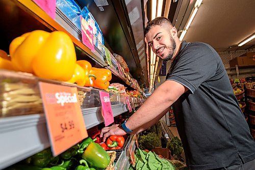 JESSE BOILY  / WINNIPEG FREE PRESS
Tarik Zeid, 21, stocks up the fruits and vegetables at the Mount Royal Foodfare on Tuesday. Zeid has worked in the family owned grocery store since he was 12 and has recently began running a farmers market in the parking lot on weekends. Tuesday, July 28, 2020.
Reporter: Eva