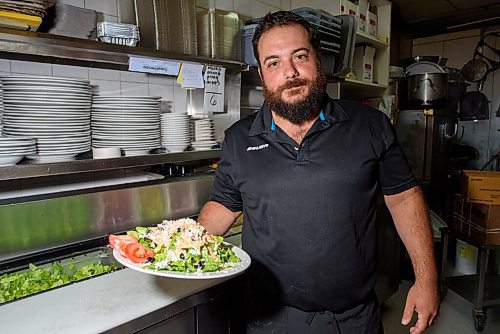 JESSE BOILY  / WINNIPEG FREE PRESS
Giorgo Kodalonis, whos worked in the family business since he was 13, shows a salad at Dals Restaurant and Lounge in Transcona on Wednesday. Wednesday, July 29, 2020.
Reporter: Allison