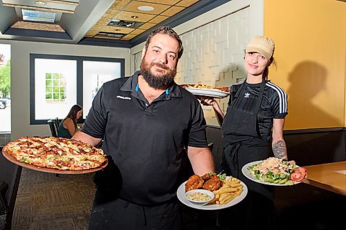 JESSE BOILY  / WINNIPEG FREE PRESS
Giorgo Kodalonis, left, and Alicia Farr serve some their food at Dals Restaurant and Lounge in Transcona on Wednesday. Wednesday, July 29, 2020.
Reporter: Allison