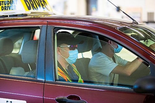 MIKAELA MACKENZIE / WINNIPEG FREE PRESS

Examiner Yuri Yermilov (left) and Diego Gilon head out on a driving test in Winnipeg on Wednesday, July 29, 2020. For Danielle Da Silva story.
Winnipeg Free Press 2020.