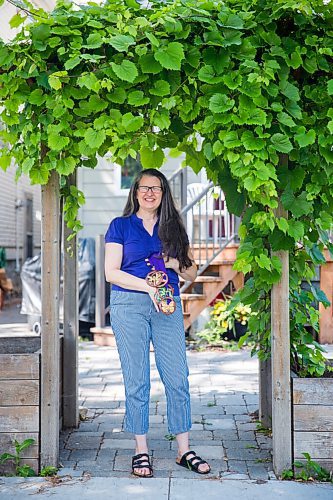 MIKAELA MACKENZIE / WINNIPEG FREE PRESS

Krista Waring, founder and race director for Run 4 Your Cause, poses for a portrait in her yard with handmade finisher medals (made by an artist in Haiti) in Winnipeg on Wednesday, July 29, 2020. The run, which took place virtually last month, is an annual event that raises funds for seven different charities. For Aaron Epp story.
Winnipeg Free Press 2020.