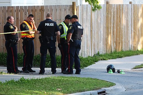 MIKE DEAL / WINNIPEG FREE PRESS

Winnipeg Police forensics unit are at the scene of an accident on Grey Street between Munroe and Moncton Avenues. That stretch or Grey Street is closed with dozens of evidence markers on the road. A helmet and a bicycle could be seen amongst the evidence markers. 
200730 - Wednesday, July 30, 2020.