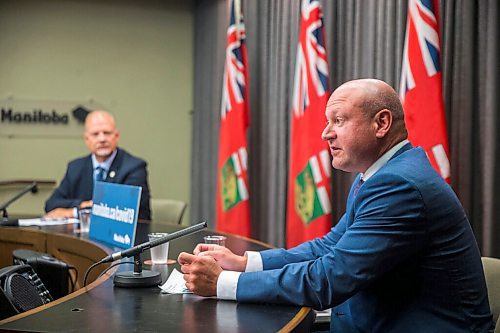 MIKAELA MACKENZIE / WINNIPEG FREE PRESS

Brent Roussin, chief provincial public health officer (right), and education minister Kelvin Goertzen speak to the media about the fall back-to-school plan at the Manitoba Legislative Building in Winnipeg on Thursday, July 30, 2020. For Maggie (and Larry?) story.
Winnipeg Free Press 2020.