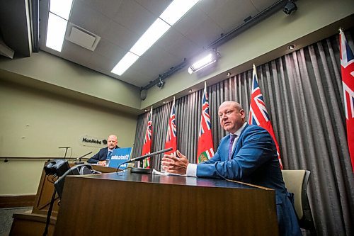 MIKAELA MACKENZIE / WINNIPEG FREE PRESS

Brent Roussin, chief provincial public health officer (right), and education minister Kelvin Goertzen speak to the media about the fall back-to-school plan at the Manitoba Legislative Building in Winnipeg on Thursday, July 30, 2020. For Maggie (and Larry?) story.
Winnipeg Free Press 2020.