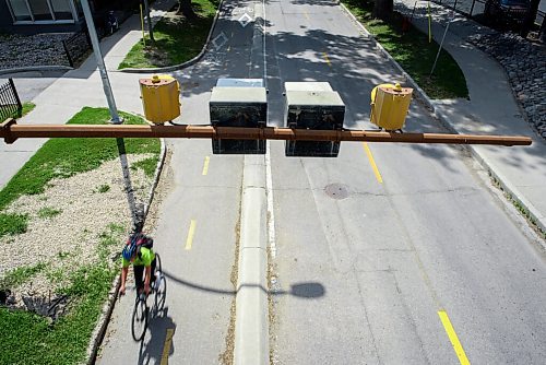 JESSE BOILY  / WINNIPEG FREE PRESS
Cyclists travel under the Midtown bridge along the Assiniboine Ave bike path on Thursday. Thursday, July 30, 2020.
Reporter: Standup