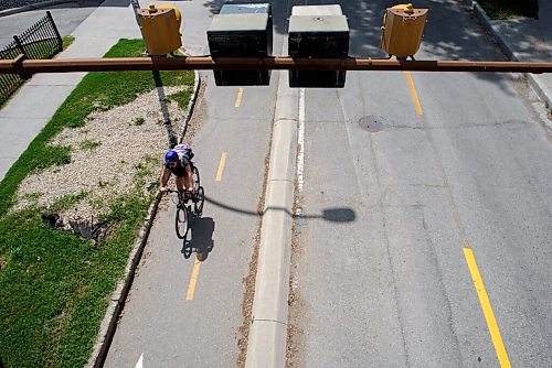 JESSE BOILY  / WINNIPEG FREE PRESS
Cyclists travel under the Midtown bridge along the Assiniboine Ave bike path on Thursday. Thursday, July 30, 2020.
Reporter: Standup