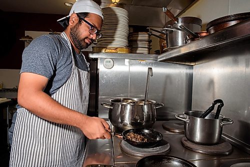 JESSE BOILY  / WINNIPEG FREE PRESS
Sarifal Ridoy makes one of the restaurants popular beef dip sandwiches at Nicks on Broadway on Friday. Friday, July 31, 2020.
Reporter: Sanderson