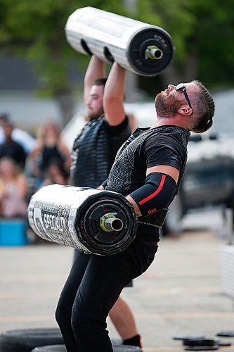 JOHN WOODS / WINNIPEG FREE PRESS
David Plett, foreground, competes in the Log Clean and Press at the third annual Manitoba Classic Strongman Competition at Brickhouse Gym in Winnipeg Sunday, August 2, 2020. Competitors competed in the Yoke - Farmers Medley, Log Clean and Press, Loading Race, Axle Deadlift and the Tire Flip. Proceeds were donated to Little Warriors childrens charity.

Reporter: Standup