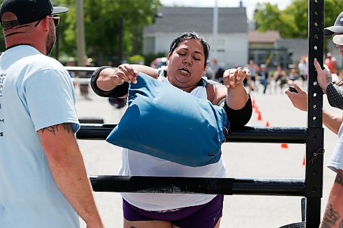 JOHN WOODS / WINNIPEG FREE PRESS
Lexi Elias tosses a sandbag as she competes in the Loading Race at the third annual Manitoba Classic Strongman Competition at Brickhouse Gym in Winnipeg Sunday, August 2, 2020. Competitors competed in the Yoke - Farmers Medley, Log Clean and Press, Loading Race, Axle Deadlift and the Tire Flip. Proceeds were donated to Little Warriors childrens charity.

Reporter: Standup