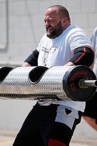 JOHN WOODS / WINNIPEG FREE PRESS
Christopher Blakley competes in the Log Clean and Press at the third annual Manitoba Classic Strongman Competition at Brickhouse Gym in Winnipeg Sunday, August 2, 2020. Competitors competed in the Yoke - Farmers Medley, Log Clean and Press, Loading Race, Axle Deadlift and the Tire Flip. Proceeds were donated to Little Warriors childrens charity.

Reporter: Standup