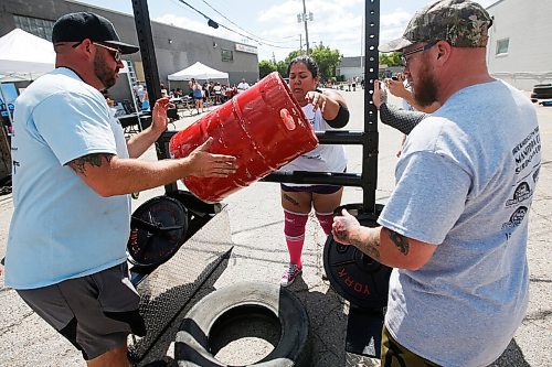 JOHN WOODS / WINNIPEG FREE PRESS
Lexi Elias tosses a keg as she competes in the Loading Race at the third annual Manitoba Classic Strongman Competition at Brickhouse Gym in Winnipeg Sunday, August 2, 2020. Competitors competed in the Yoke - Farmers Medley, Log Clean and Press, Loading Race, Axle Deadlift and the Tire Flip. Proceeds were donated to Little Warriors childrens charity.

Reporter: Standup