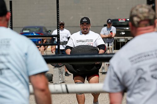 JOHN WOODS / WINNIPEG FREE PRESS
Jan Bal-ot carries a 200lb sandbag as he competes in the Loading Race at the third annual Manitoba Classic Strongman Competition at Brickhouse Gym in Winnipeg Sunday, August 2, 2020. Competitors competed in the Yoke - Farmers Medley, Log Clean and Press, Loading Race, Axle Deadlift and the Tire Flip. Proceeds were donated to Little Warriors childrens charity.

Reporter: Standup